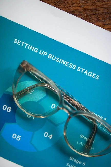 Close-up of SEO strategy planner with colorful sticky notes and a pencil on a notebook.